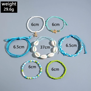 Detailed set of seashell starfsh and turtle bracelets with woven cords and pearls