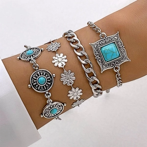 Close-up of bohemian turquoise and silver-plated leaf flower multi-layer bracelets