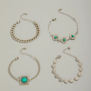 Detailed close-up of 4-piece bohemian bracelet set with turquoise and floral motifs
