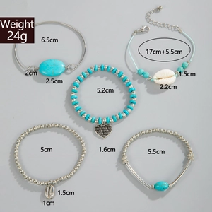 Five-piece Bohemian bracelet set with turquoise beads, shell charms, and heart pendant detail