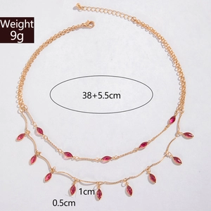 Detailed view of double-layer gold necklace with purple teardrop crystal pendants and dimensions