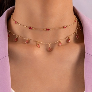 Elegant double-layered gold necklace with marquise-cut red rhinestones and drop tassels