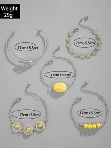 Detail of 5-piece silver bohemian bracelet set with turquoise stones and leaf charms