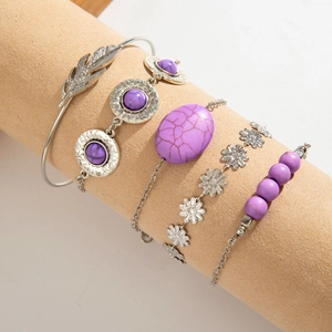 Detail view of 5-piece Bohemian silver bracelets with purple turquoise and floral charms