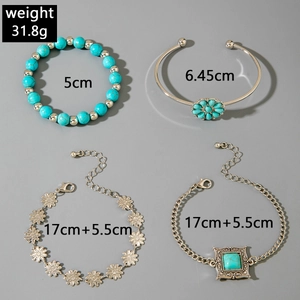 Detail view of 4-piece bohemian turquoise bracelet set showing sizing and metal textures