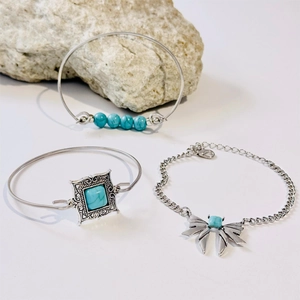 Bohemian silver jewelry set featuring turquoise leaf motifs and a bowknot bracelet