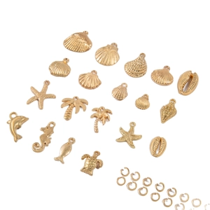 Golden ocean theme alloy charms set with starfish shell and turtle pendants in a flat lay