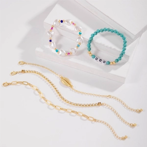 5-piece bohemian bracelet set with turquoise beads, golden conch charm and heart beads