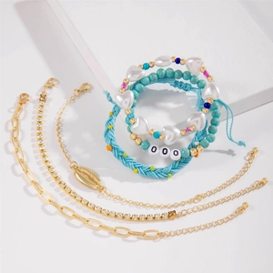 Bohemian multilayer bracelet set featuring blue beads, shell charms and gold metal chains
