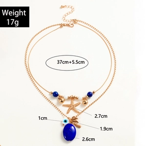 Detailed view of layered necklace with starfish pendant and devil's eye bead 17g