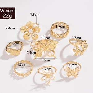 Parure de 8 bagues dorées avec fleurs en perles papillons et feuilles évidées