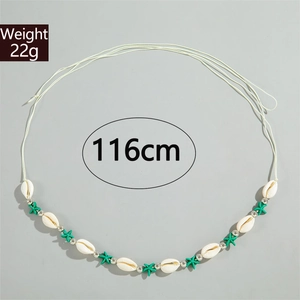 Detail of beach style waist chain with seashells and turquoise starfish beads