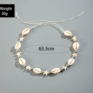 Detail view of beach style seashell and starfish body chain with 63.5cm length markings