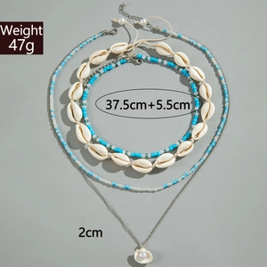 Détail du lot de colliers en coquillages avec poids de 47g et longueur de 37,5cm