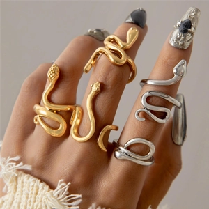 Fashionable snake wrap ring set in gold and silver finish worn by a model