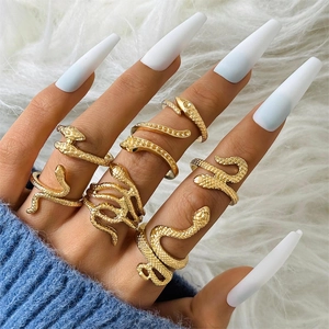 Golden snake ring set for women featuring multiple coiled serpent designs and scale texture