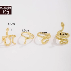 Detail of four gold snake rings with scale textures and size markers 1.7cm to 1.9cm