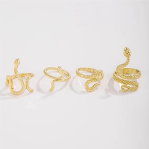 Set of four gold-colored snake-shaped rings featuring diverse spiral designs and textures