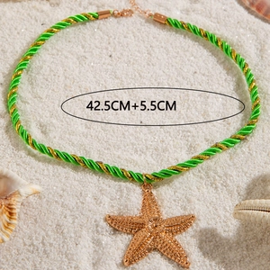 Detail of starfish pendant necklace on beach sand showing 42.5cm plus 5.5cm chain length