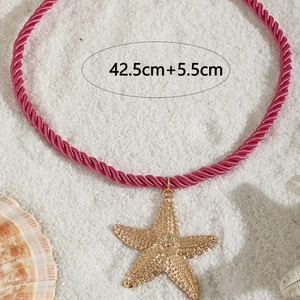 Detail of pink woven necklace with gold starfish pendant and 42.5cm size markings
