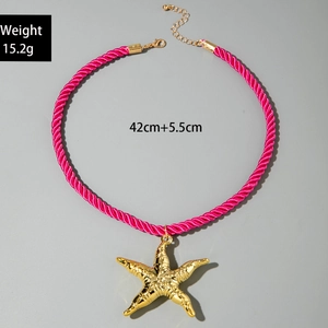 Pink woven rope necklace featuring a textured gold starfish pendant and weight detail