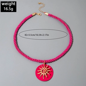 Detail view of pink cord necklace with sunburst pendant and 42+5.5cm size markings