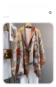 Detail of imitation cashmere scarf featuring vintage landscape print and fringe trim