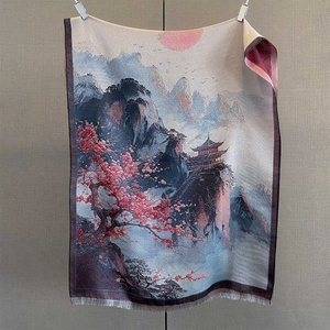 Detailed texture of jacquard landscape scarf featuring elegant tassels and mountain scenery