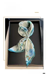 Detail of 53cm mulberry silk square scarf with blue peony and bamboo patterns and pearl buckle