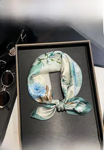 Detail showing 100% mulberry silk square scarf with floral print and green edge