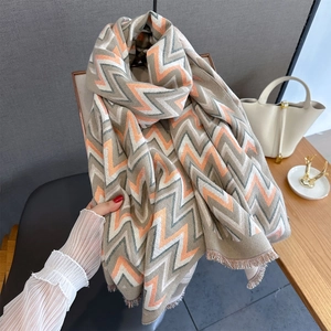 Detailed view of the wavy chevron pattern and fringe edge on a thick pashmina shawl