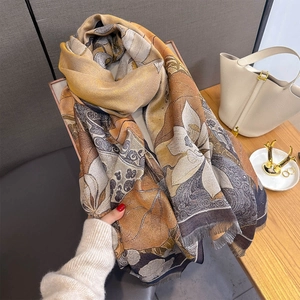 Floral landscape cashmere feel scarf with warm tones and elegant fringe edges for women