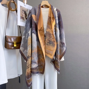 Detailed texture of oil painting landscape scarf with elegant fringe tassels in warm tones