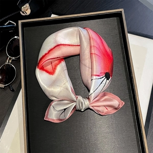 Detail of premium silk small square scarf with artistic pink floral ink print and rolled edges