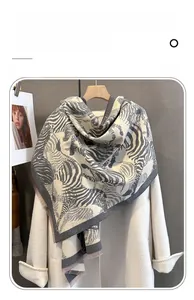 Detailed close-up of soft imitation cashmere scarf with black and white zebra pattern