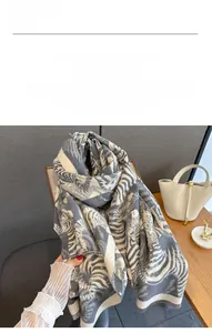 Close-up of soft imitation cashmere fabric with grey and white zebra jacquard pattern
