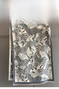 Detailed view of black and white zebra pattern scarf with fine jacquard woven texture
