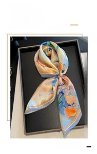 Detail of artistic oil painting silk scarf with mulberry silk texture and decorative pearl