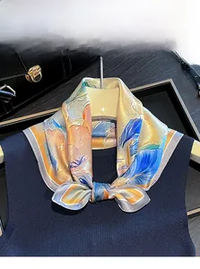 Detailed view of a 100% mulberry silk square scarf with colorful artistic floral prints