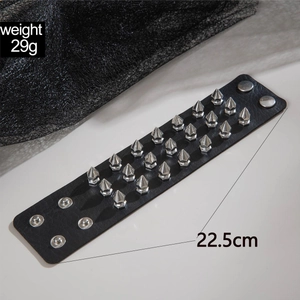 Detail of punk black PU leather bracelet with silver metal studs and snap buttons
