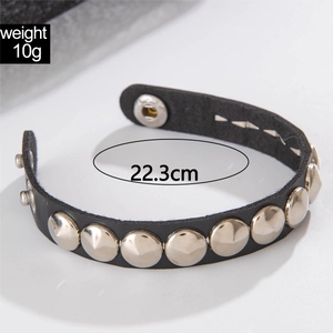 Detail view of black punk leather choker with silver studs and adjustable metal snaps
