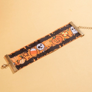 Detail view of Halloween-themed choker featuring pumpkin prints and golden lobster clasp
