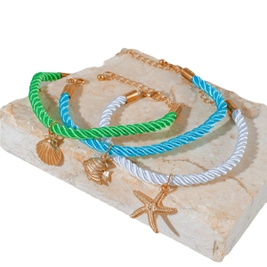 Three-piece bohemian beach anklet set featuring starfish, scallop, and fish charms