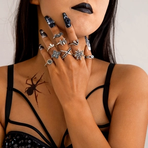 Gothic skull and spider ring set with vintage silver finish on female model hands