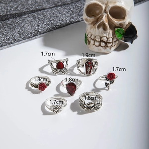 Gothic ring set detail with skull, rose, and red stones showing 1.7-1.9cm inner diameters
