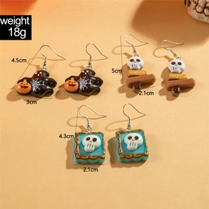 Detail of Halloween earring set showing sizes of ghost and skull acrylic pendants