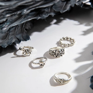 Gothic silver ring set featuring skull, spider and web designs for Halloween punk style