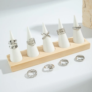 Nine-piece punk geometric silver ring set featuring woven and cross patterns on stands