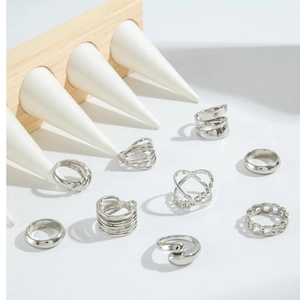 8-piece set of silver punk style geometric rings featuring twist, chain, and hollow designs