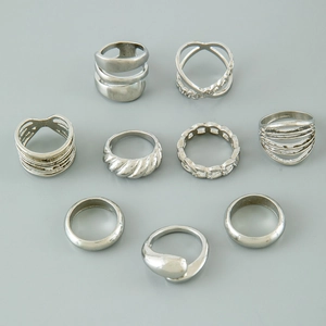 9-piece silver punk ring set featuring heart, twist, and geometric minimalist designs